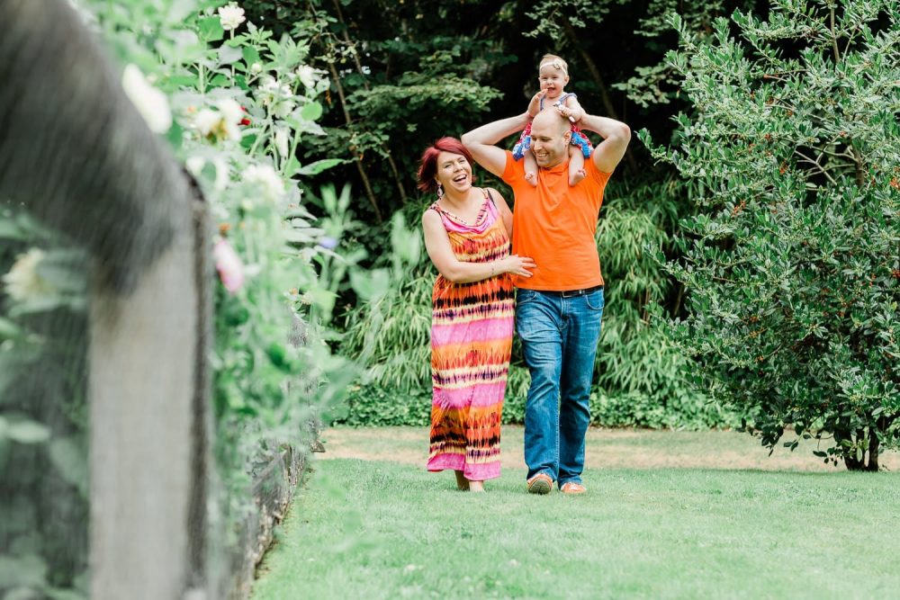 Couple walking and hugging with the baby. Family Photo in Burnaby Village Museum