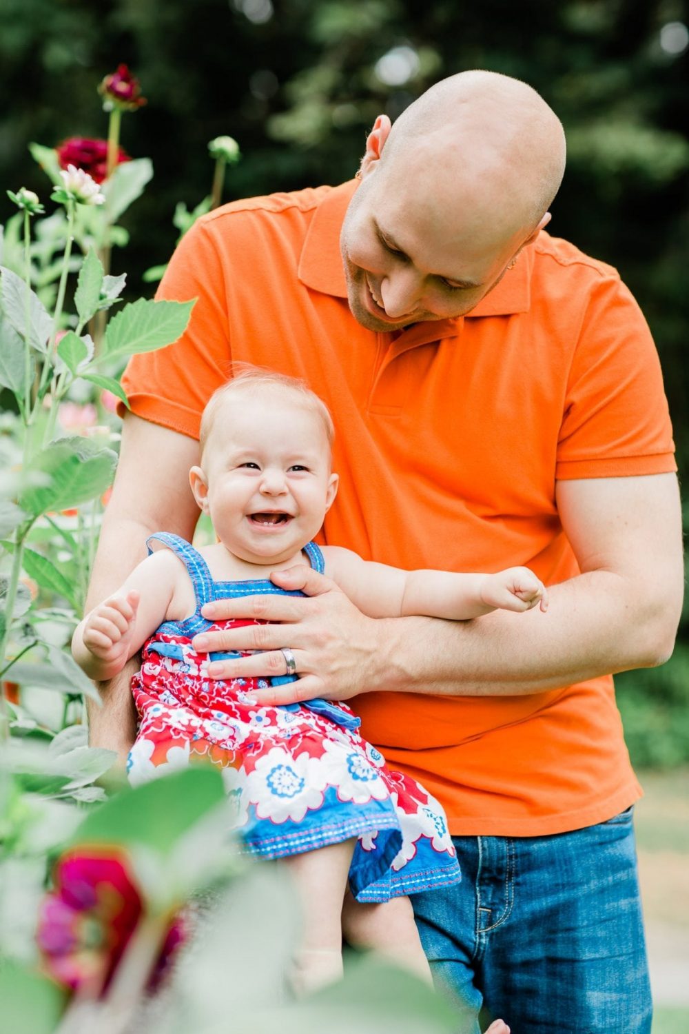 Father holding a smiling baby girl. Family Photo in Burnaby Village Museum