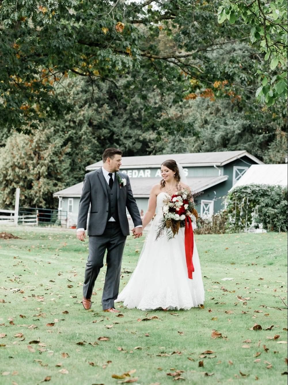 Bride and groom walking in the park | Vancouver Weddings Photographer