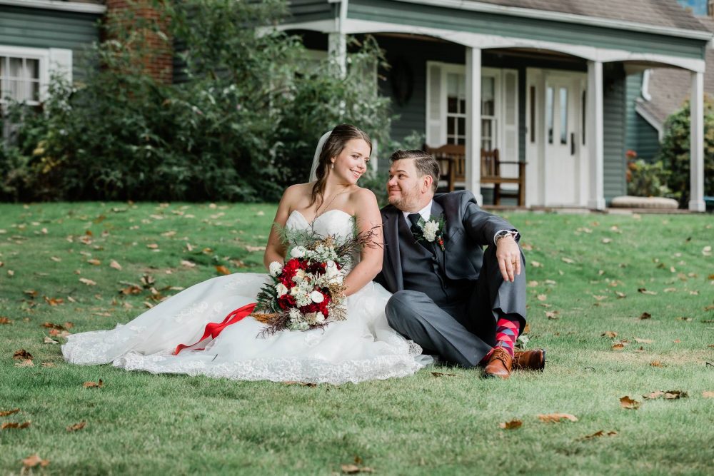 Happy bride and groom posing on the grass | Vancouver wedding photographer