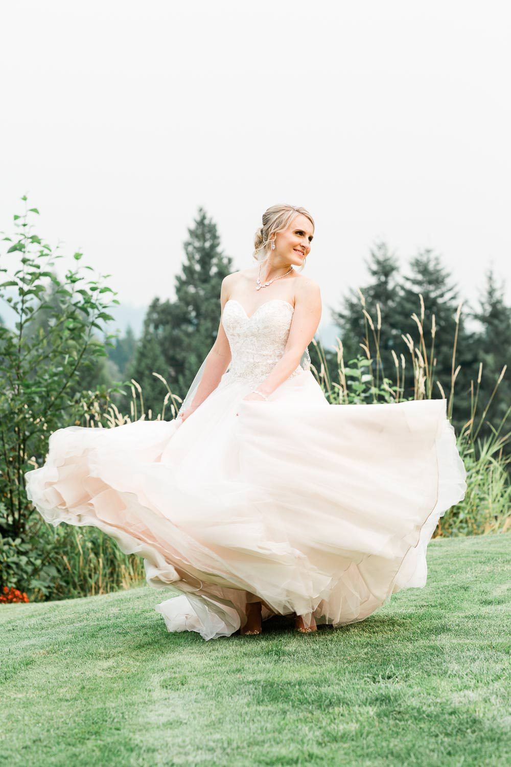Stunning bride dancing on the grass | Vancouver wedding photographer