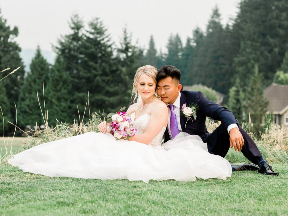 Bride and groom posing on the grass | Vancouver wedding photographer