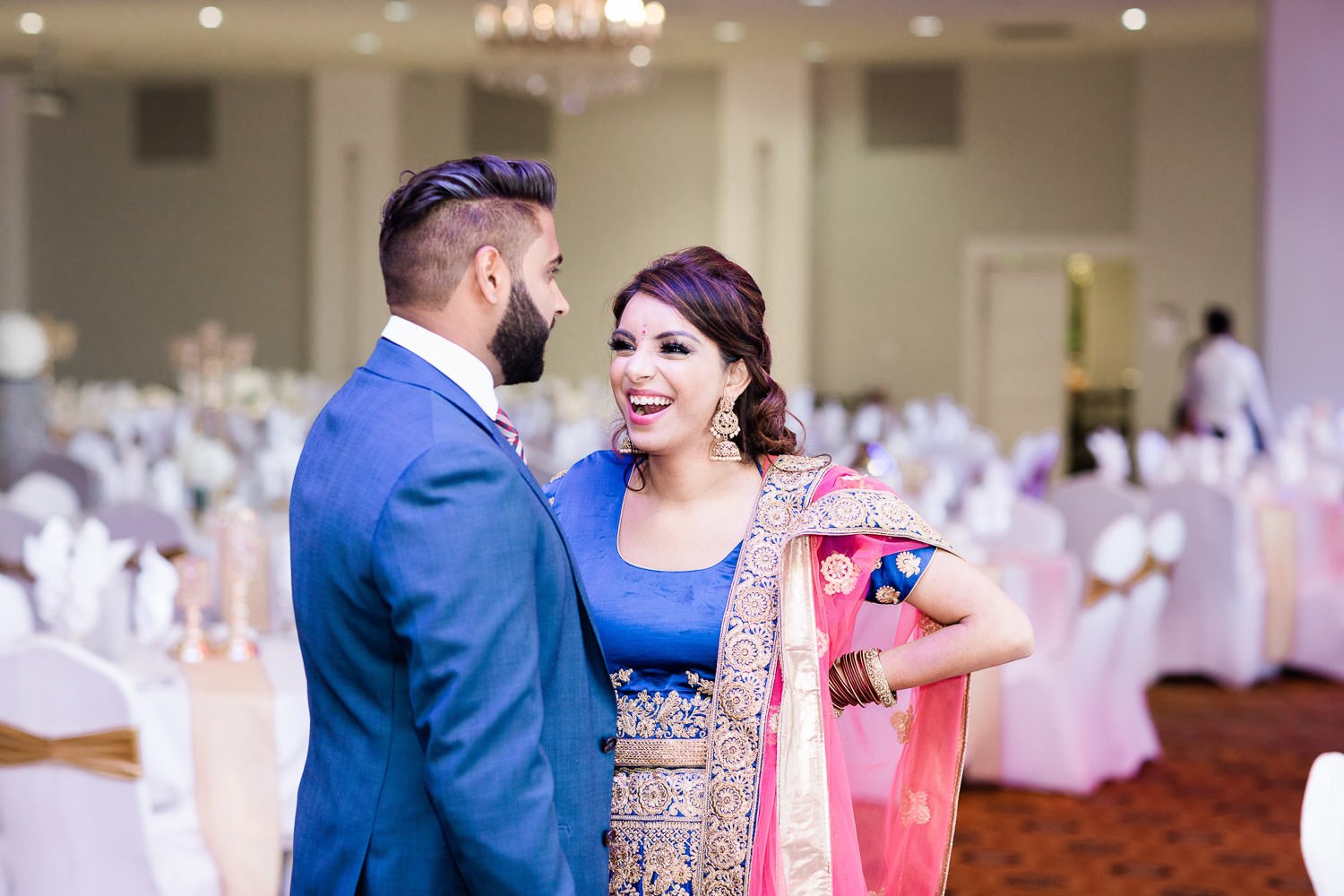 Indian couple laughing at the indian engagement ceremony