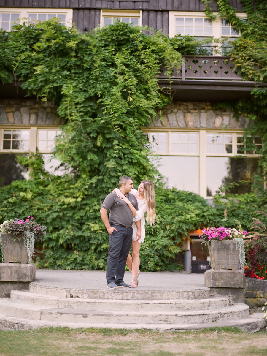 Couple posing during engagement session in Stanley park with wedding photographer in Vancouver